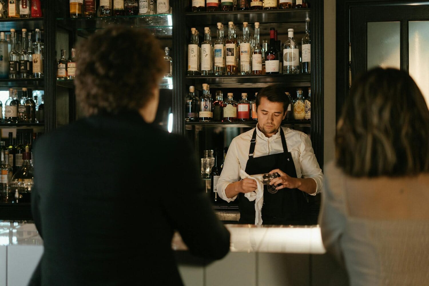 Bartender preparing a glass for service