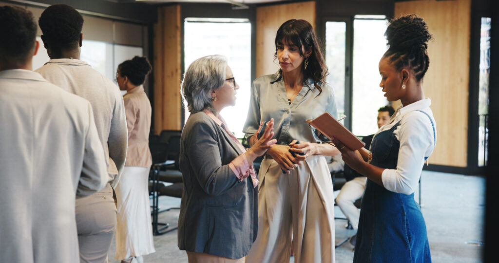Talking, networking and business people at seminar, feedback and intro with media conference.