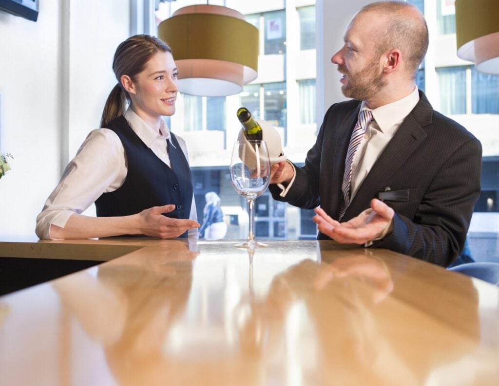 Manager training a member of staff