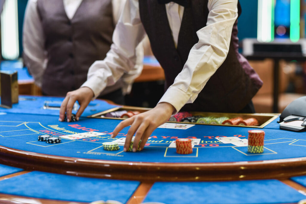 Casino Blackjack Dealer Setting Chips And Cards