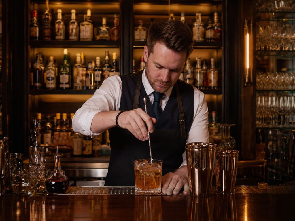 Rooftop Bartender Serving a Martini